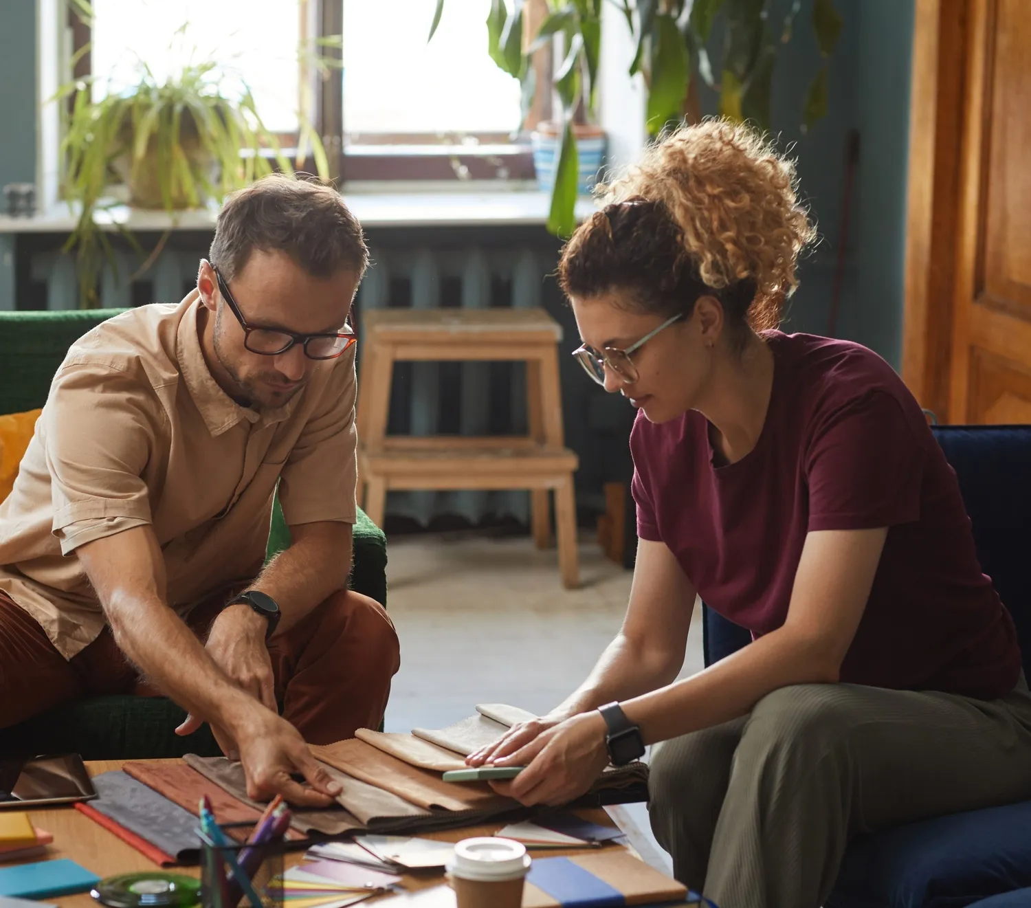Two colleagues working through documents together