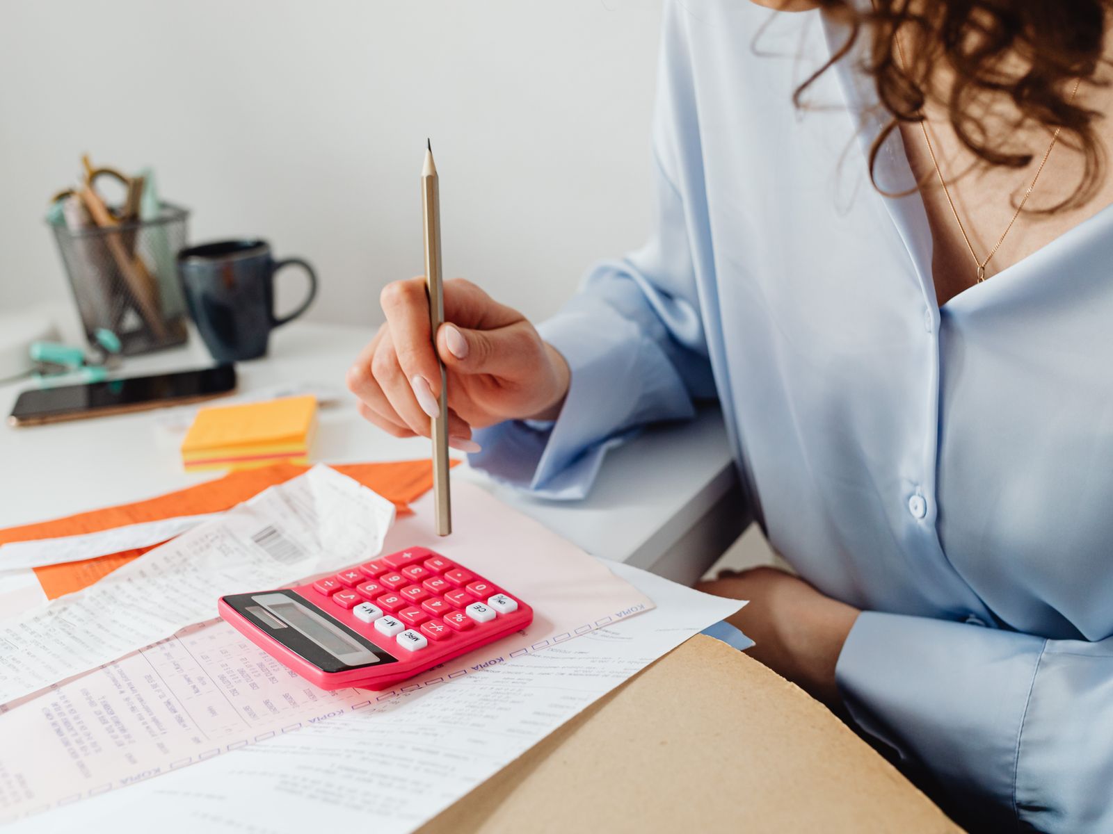 Finance assistant working through expenses and statements