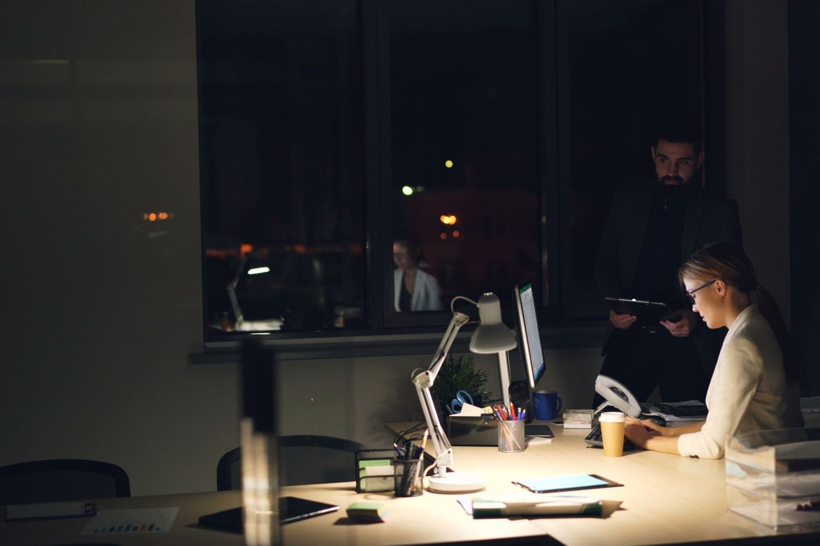 Accounts payable team processing invoices at their desks