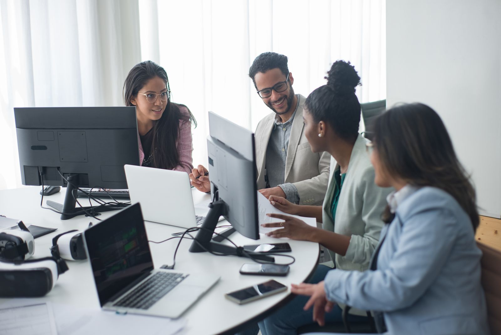 IT and finance colleagues reviewing technology spend together on screen