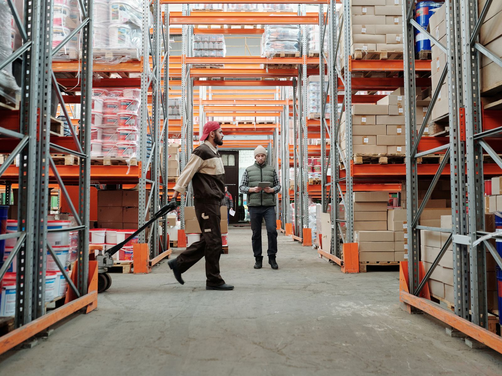 Warehouse team checking inventory against a delivery