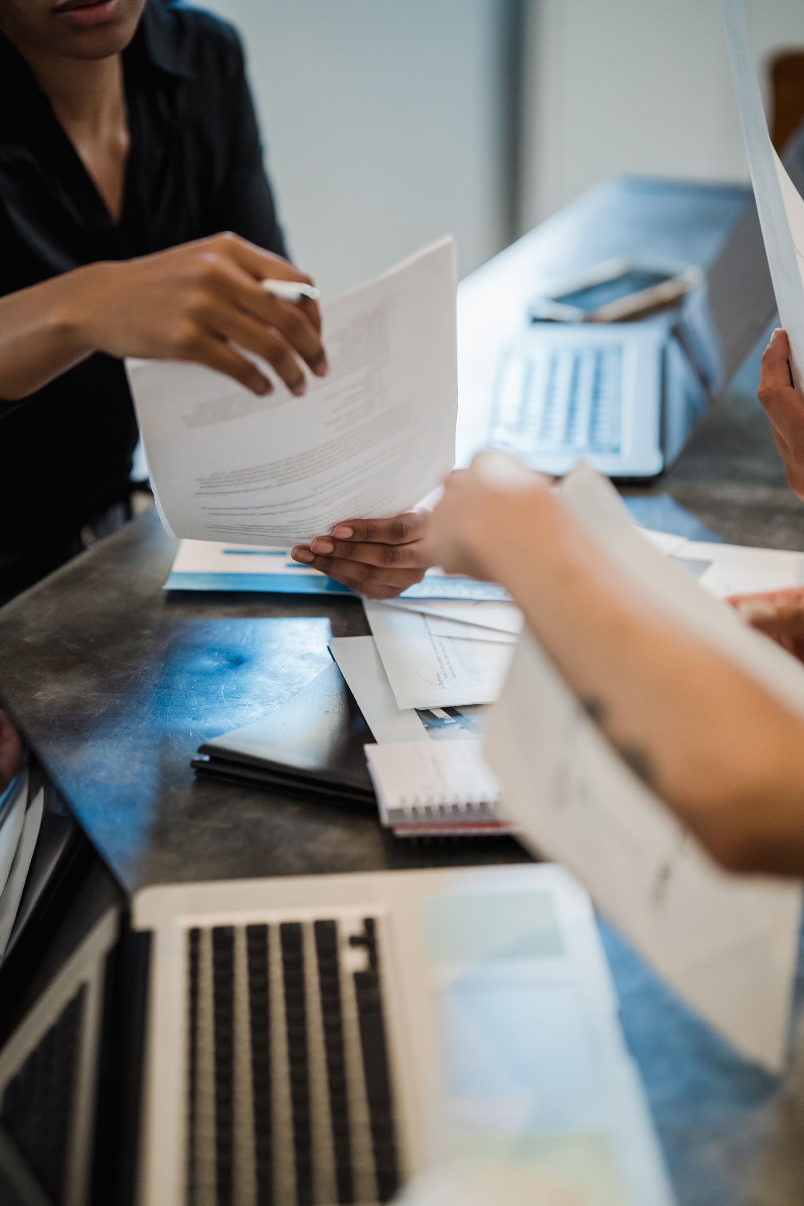 One team handing a document from ordering across to payables