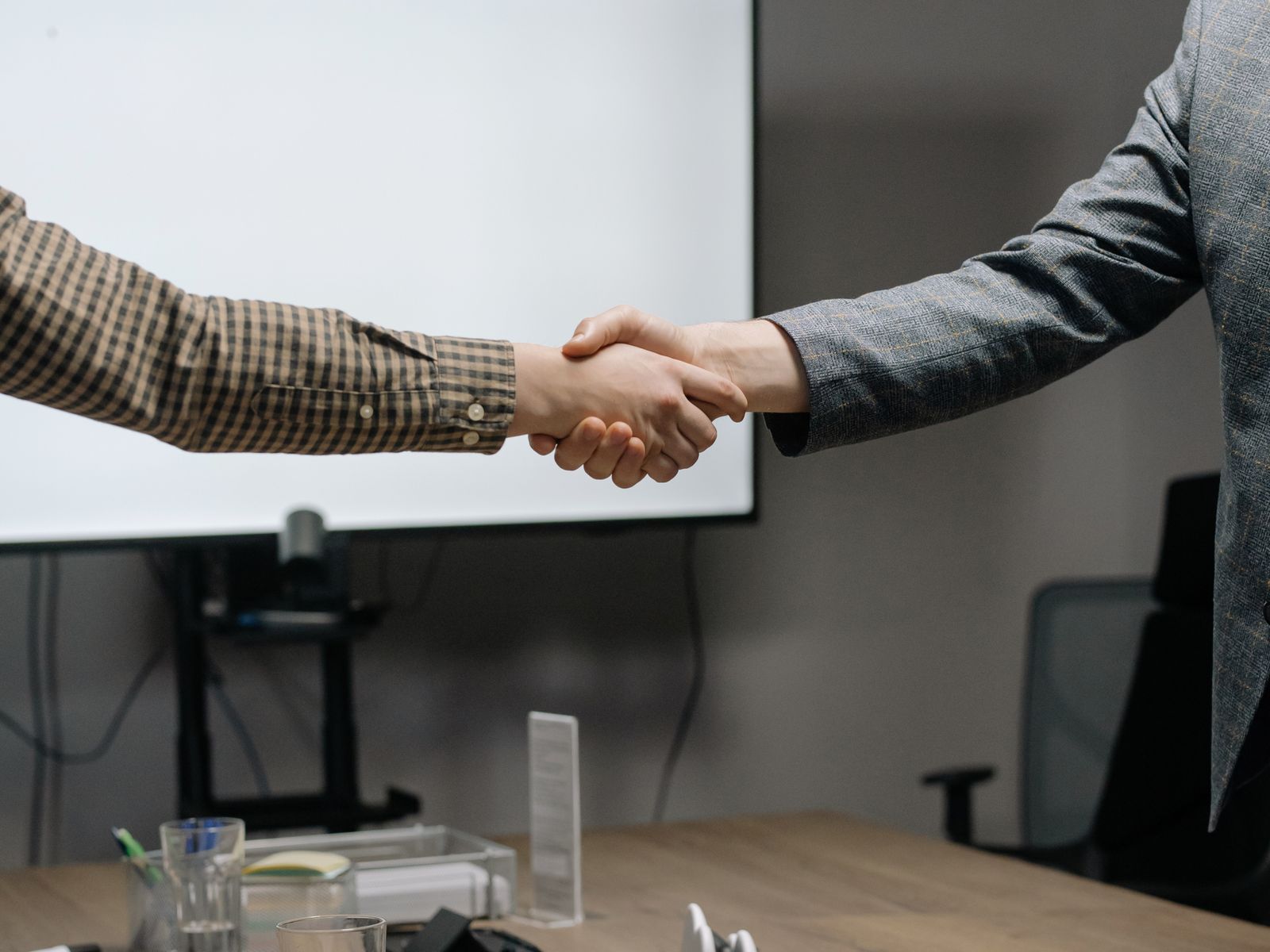 Buyer and supplier shaking hands after a negotiation